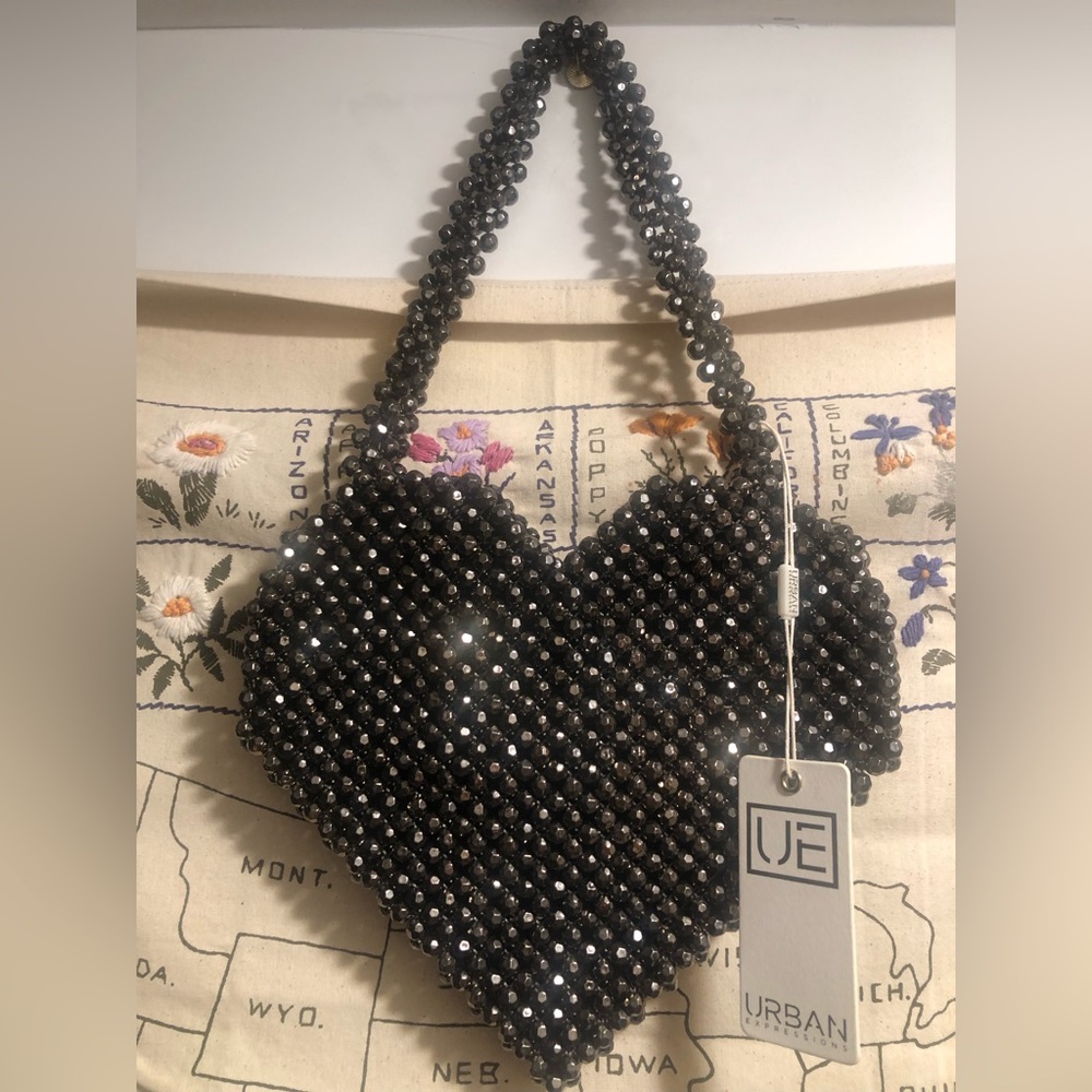 Metallic black heart-shaped handbag